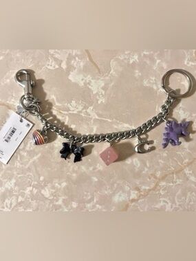 Coach Silver Charm Bracelet with Pink Dice and Black Bow Charms